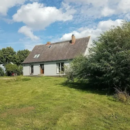 Holiday house with a large garden and swimming lake in the village