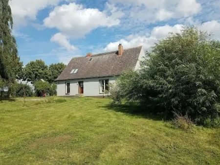 Holiday house with a large garden and swimming lake in the village