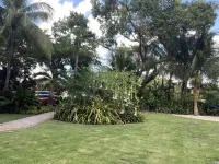 Lush gardens on the Earmen River with heated pool Hotels near Juno Beach Park