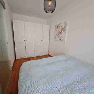 Modern city apartment with balcony and private parking space in a quiet location Rooms