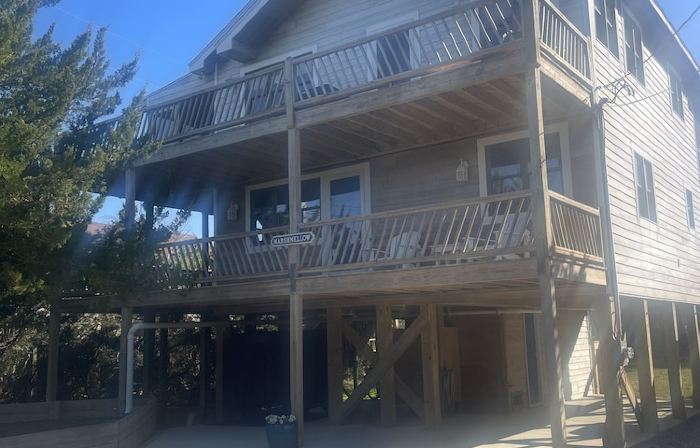 Three-bedroom house with views, decks, golf cart and home gym!