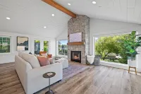 Custom Home with Lake Views + Cozy Fireplace