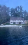 A quiet cove, the sunset and a sandy beach, on Lake Winnipesaukee