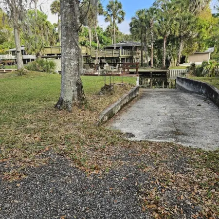 Cozy canal front house with its own boat ramp and dock. Amazing waterfront view.