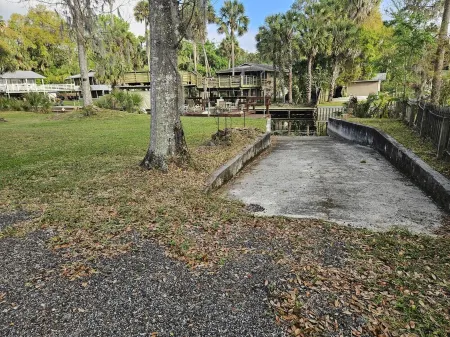 Cozy canal front house with its own boat ramp and dock. Amazing waterfront view.