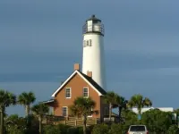 TROUT Steps to beach. Lovely two bedroom with screened porch and pool.