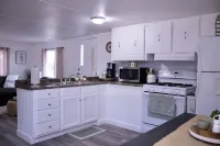 Cozy 2-bedroom mobile home in lovely Encampment with AC, WiFi Hotels in Encampment