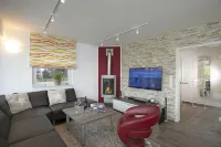 Vacation home directly on the lake, outdoor whirlpool and exclusive 20sqm wellness sauna Hotels in Gohren-Lebbin