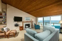 Expansive Oceanfront Patio and Resort-Style Amenities - Charming Coastal Haven