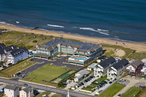 Oceanfront Deck and Community Pool - Inviting Coastal Sanctuary