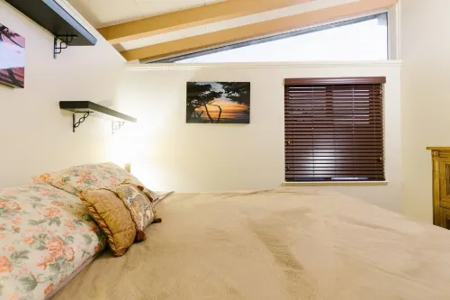 Monterey craftsman style home with vaulted exposed-beams ceiling hardwood floor