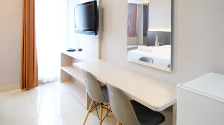 Luxurious Studio with Long Golf View at Grand Sungkono Lagoon Apartment