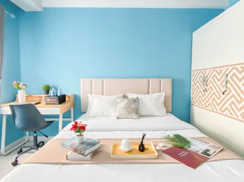 Neat Studio with Blue Toned Wall at Dramaga Tower Apartment By Travelio