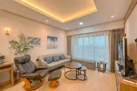 Modern Look with Wooden Accent 3BR at Kondominium Puncak Marina Apartment By Travelio