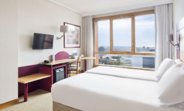 a modern hotel room with a large window offering a view of the city , white bedding , and desk area at Abba Garden