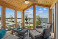 Cozy, year-round lake home with magnificent sunset views, lake access and dock.