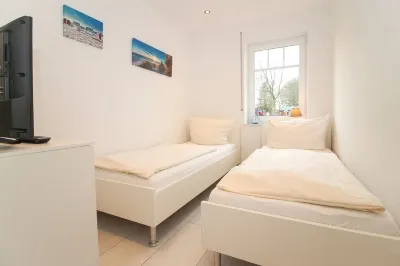 Bright, modern ground floor apartment for 4 people including four-legged friends Hotels near Norden Altstadt