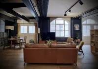 Spacious studio apartment with 20th Century Modern design in an industrial space
