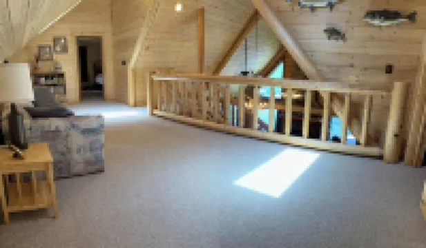 Large six-bedroom loghome w/ private boat ramp, dock, movie room and pool room.