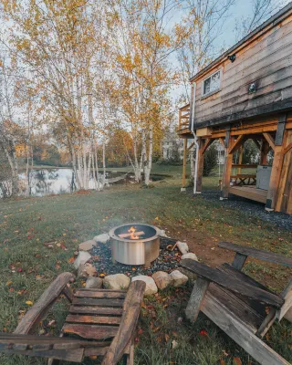 Treehouse lifted up over a stocked trout pond up in the beautiful birch trees!