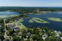 AMAZING NEWER HOME WITH LAKE VIEWS, steps away from shops and restaurants.