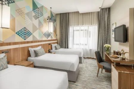 Roots Hotel Отели рядом с достопримечательностью «King Abdullah Library»