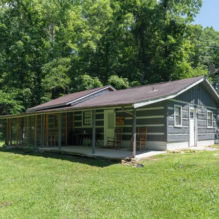 Moonshine Cabin with a nice yard on the creek in the shadows of the Smokies