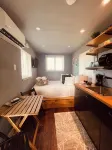 Tiny house on an acre with ocean view and private infinity pool.