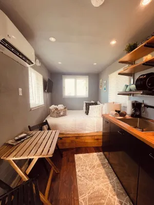 Tiny house on an acre with ocean view and private infinity pool.