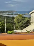 A colored beacon sitting on the hill side road that leads into Sandy Ground, Hoteles cerca de Sandy Island