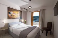 Stork Holiday Apartments - Garden & Sea View Hotels in Asíni