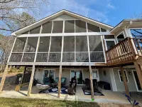 Spacious 7-bedroom, 5-bath home on 168' of a wide, deep-water cove.