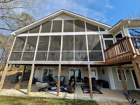 Spacious 7-bedroom, 5-bath home on 168' of a wide, deep-water cove.