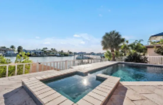 Indulge in Luxury at This Expansive Three-Story Waterfront Retreat.