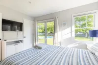 Chic Hamptons Home with Heated Gated Pool and Grill - 4-Star