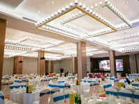 Xinchang Wozhou Junyi Hotel - servizio colazione