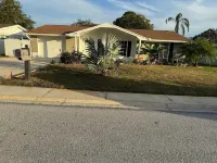 This cozy house comes with 3 bedrooms, 2 baths and a private swimming pool. Hotels near Ridge Road Shopping Center