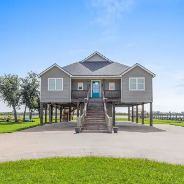 REEL N  REST in Hackberry LA ! Waterfront home with beautiful views .