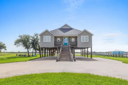 REEL N  REST in Hackberry LA ! Waterfront home with beautiful views .