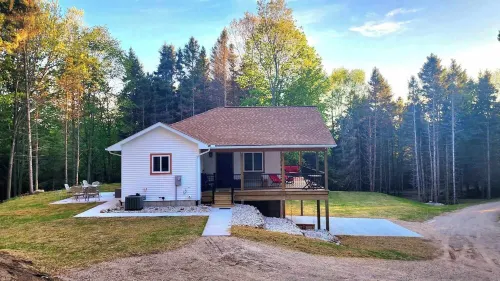 Experience panoramic views in ur 5-bed Frankfort retreat minute to Lake Michigan