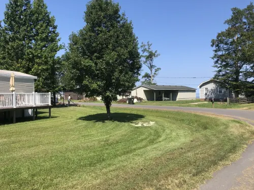 Near the water  and close to a  boat ramp