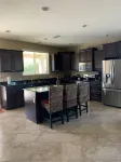 Great family friendly home very private back yard, heated pool & covered patio.