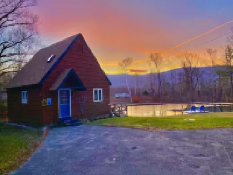 Home with a spring-fed pond and mountain view.