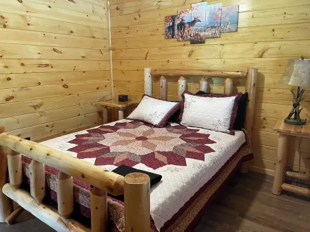 Secluded Cabin with a mountain view, hot tub, full kitchen, and living room.