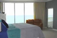 Floor to Ceiling Windows Overlook the Gulf of America's Pristine White Beaches