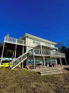 Serene Getaway with Hot Tub, Sauna, Firepit, Kayaks, Pontoon & Jet Ski Rentals!