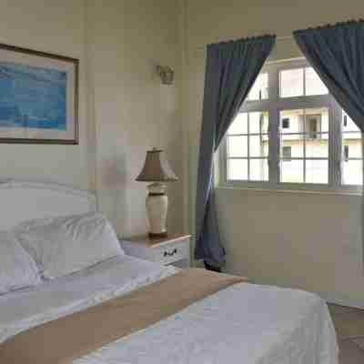2-bedroom Gated Oasis with parking andPool Rooms