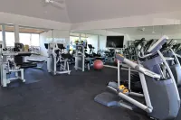 Luxury Beach side escape, steps from private beach, restaurant, marina, and café