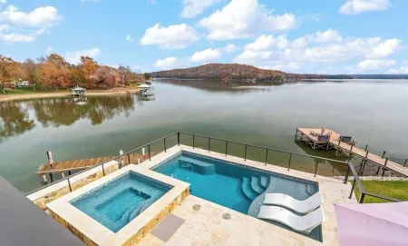Luxurious Lakefront Home with a Private Saltwater Pool, Spa, & Deep-Water Dock