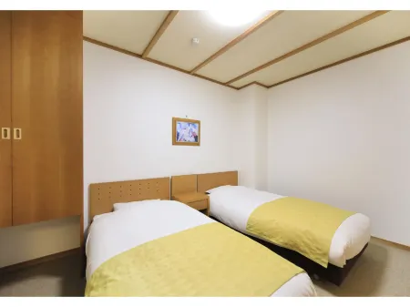 Omaki Spa Kanko Ryokan Отели рядом со станцией JR Etchu-Yamada station